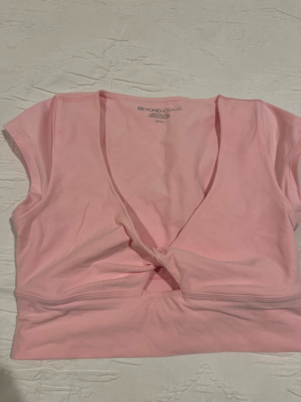 Beyond Yoga Light Pink Twist-Front Crop Top